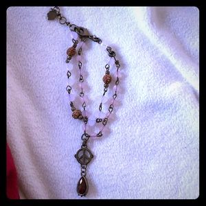 Cute beaded bracelet with peace sign detail